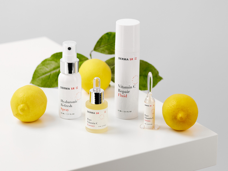 Skin care products and lemons on a white table