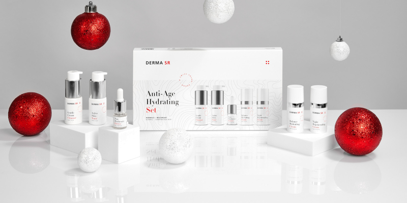 Skin care products with Christmas balls as decoration on a table