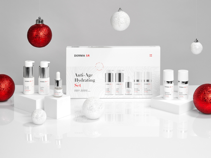 Skin care products with Christmas balls as decoration on a table